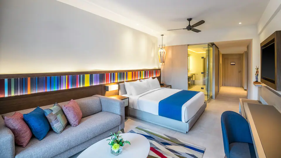 Club Ocean View One Bedroom Grand Master Suite with king bed and sitting area at Hyatt Zilara Cap Cana.