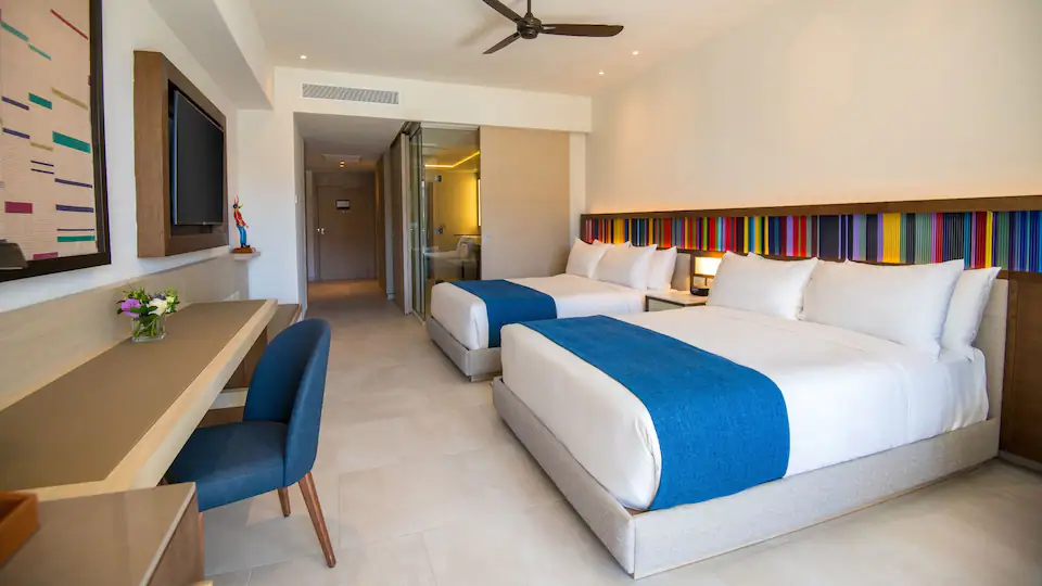 Club Oceanfront Junior Suite Swim-Up Double with two queen beds and oceanfront swim-up access at Hyatt Zilara Cap Cana.
