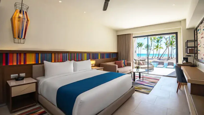 Club Oceanfront Junior Suite Swim-Up King bedroom with king bed and panoramic ocean views at Hyatt Zilara Cap Cana.
