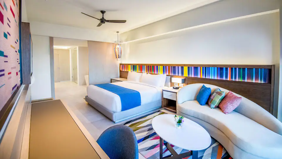 Club One Bedroom Master Suite interior with king bed and lounge seating at Hyatt Zilara Cap Cana.