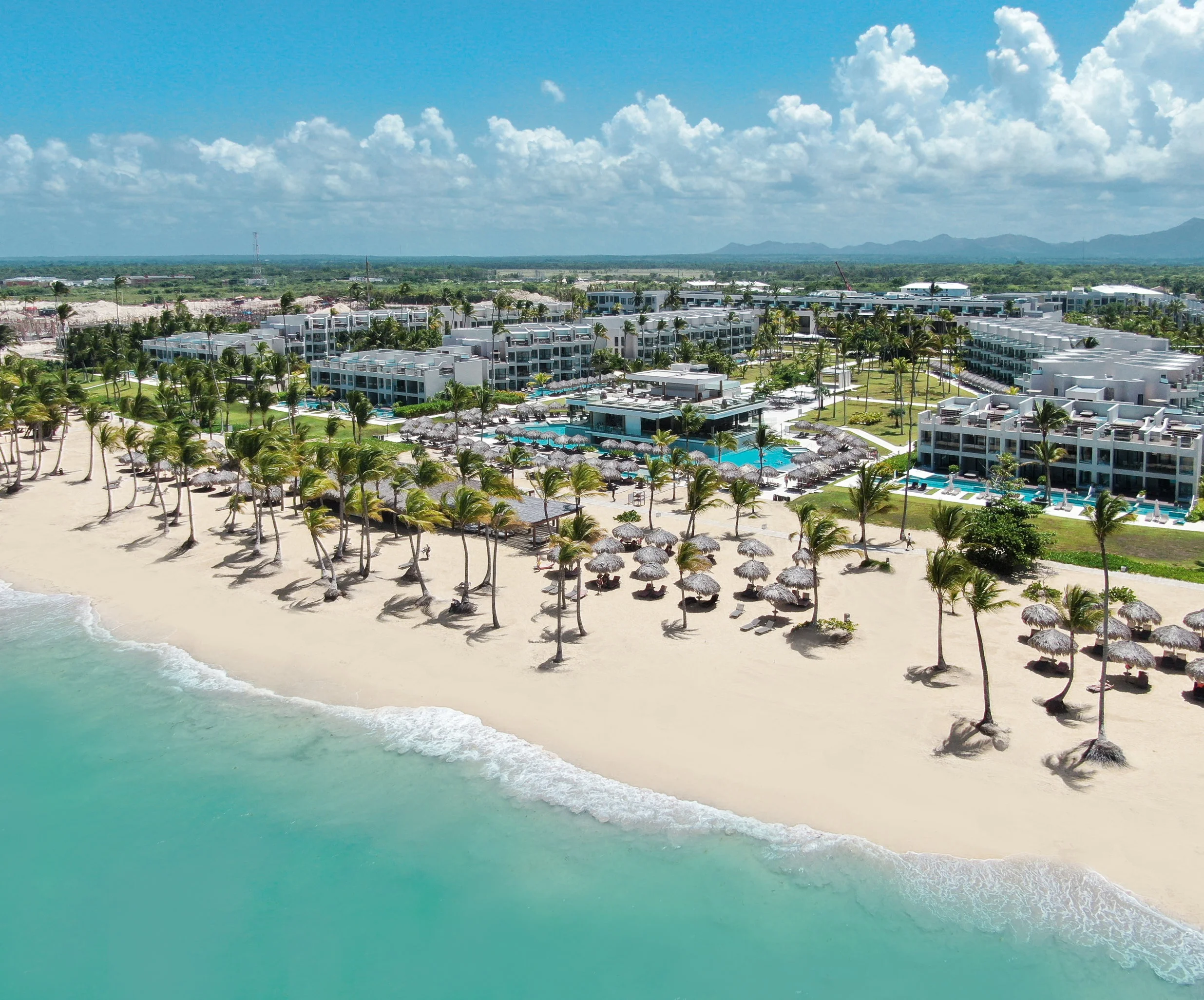 Excellence El Carmen adults-only all-inclusive resort with modern suites and beachfront pools in Punta Cana.