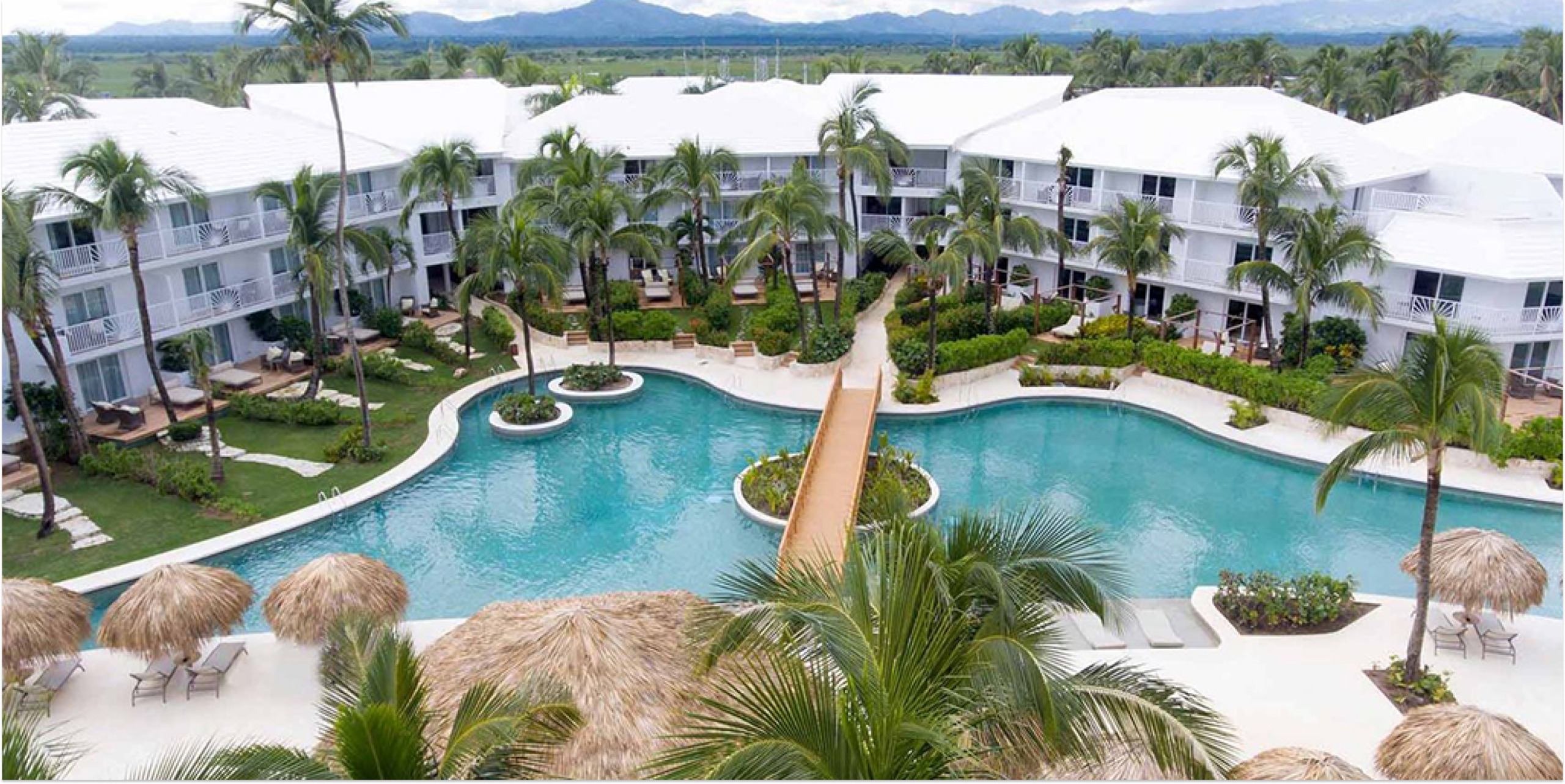 Excellence Punta Cana adults-only all-inclusive beachfront resort with tropical pools and ocean views.