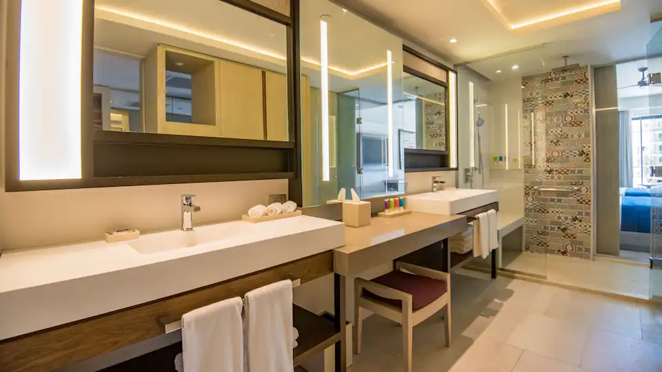 Junior Suite King bathroom with double vanity and separate walk-in shower at Hyatt Zilara Cap Cana.
