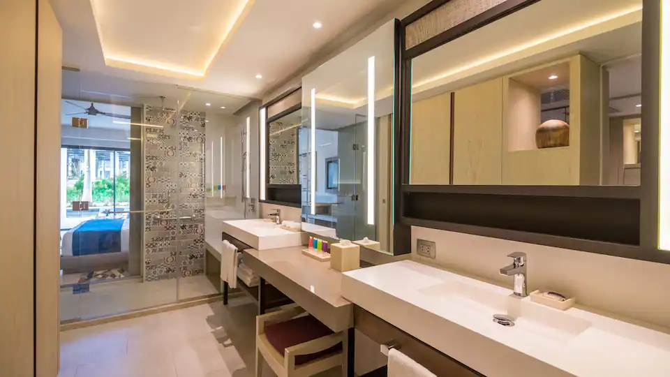 Modern bathroom with double vanity in the Junior Suite Swim-Up King at Hyatt Zilara Cap Cana.