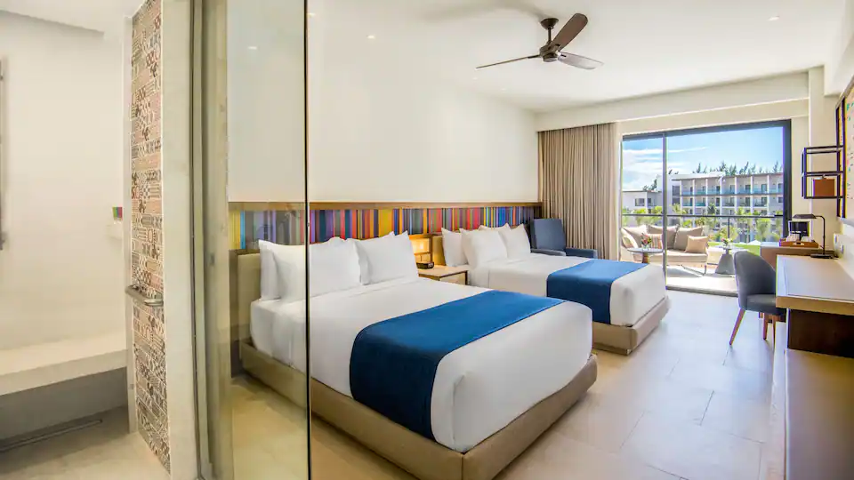 Ocean View Junior Suite Double with two queen beds, sleeper sofa, and balcony access at Hyatt Zilara Cap Cana.