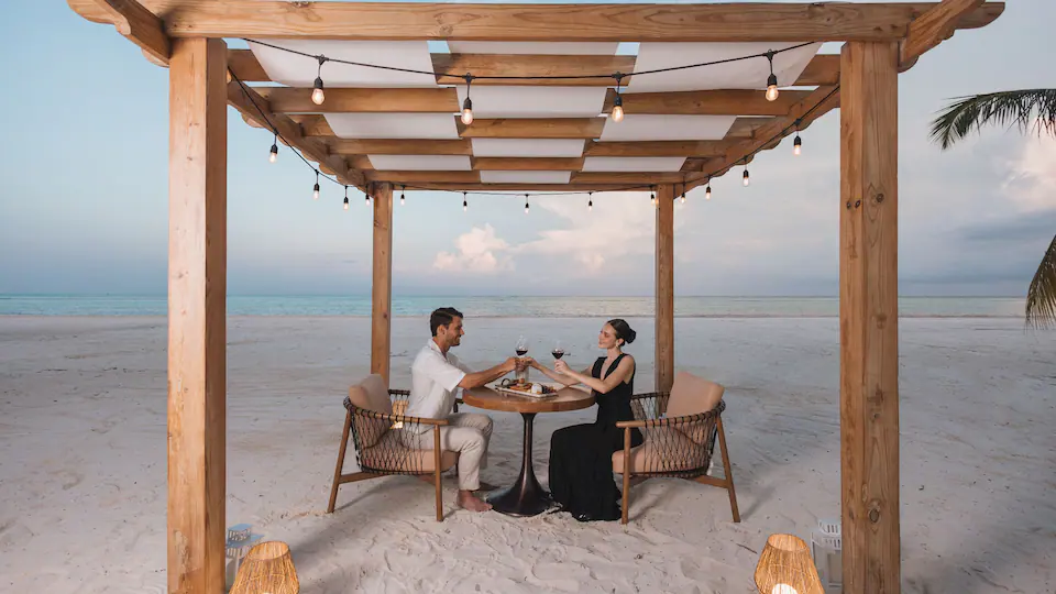 Premium Private Dining at Hyatt Zilara Cap Cana featuring an elegant oceanfront table setting, personalized service, and a romantic luxury dining experience.