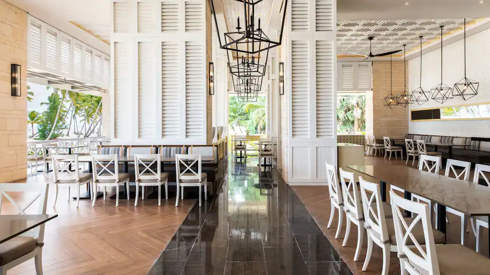 Shutters Beachside restaurant at Hyatt Zilara Cap Cana featuring relaxed beachfront dining, tropical décor, and scenic ocean views.
