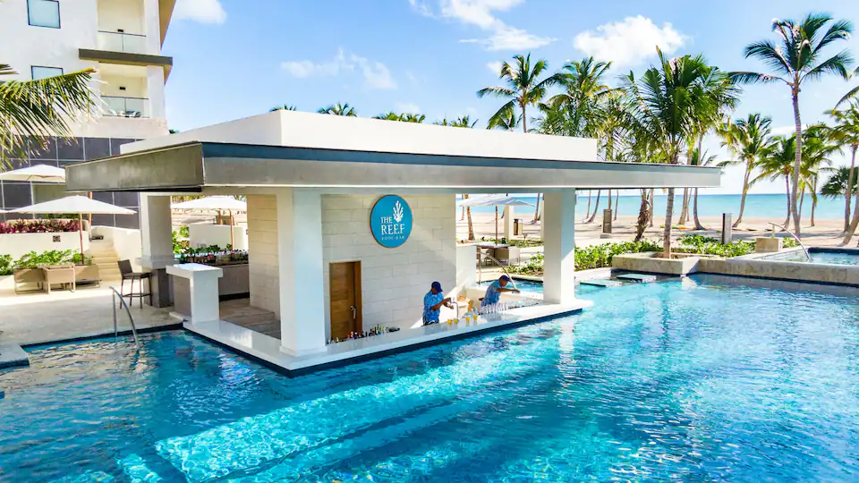 The Reef beachfront restaurant at Hyatt Zilara Cap Cana featuring open-air dining, tropical surroundings, and panoramic ocean views.