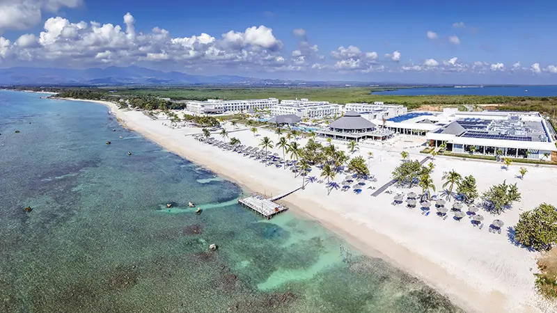 Zel Punta Cana all-suite all-inclusive resort with modern architecture, tropical landscaping, and resort-style pools in Punta Cana.